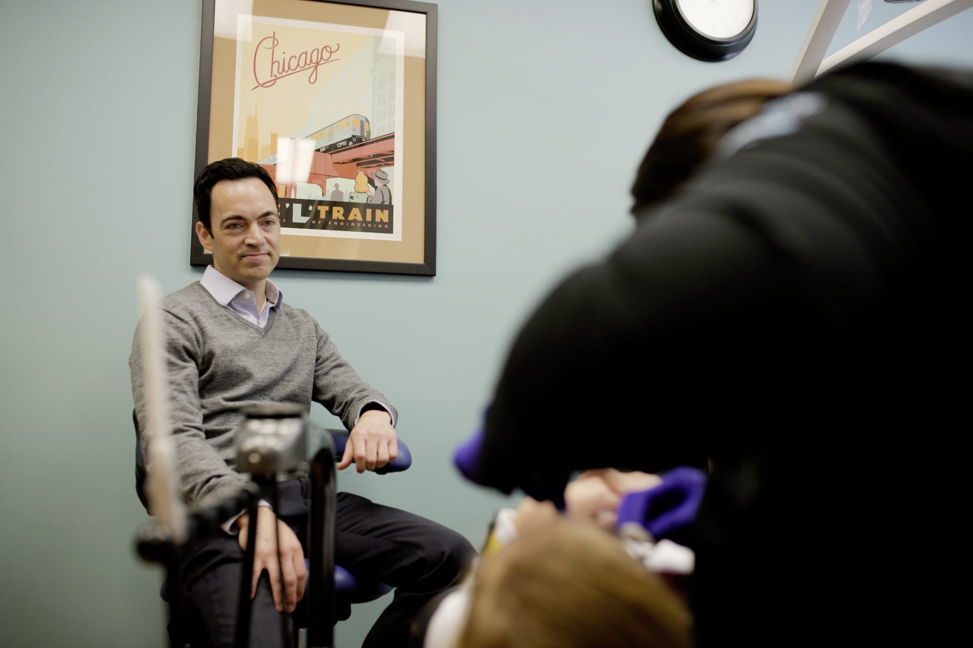 Patient's father looking on